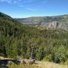 The far side of Pine Creek's Canyon is seen in the distance, across Pine Creek Valley when steeply descending into the valley on Long Lake Trail.