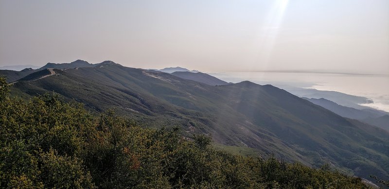 Another view from  Gaviota Peak looking back towards Santa Barbara. Fire road seen on the ridge to the left