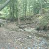 Route to Buttermilk Falls follows a stream.