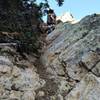 This is the trail just below the ridge at the start of the New York Lake Trail. It is VERY steep and rocky. You'll need both hands to go down (and back up).