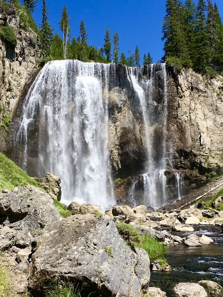 Dunanda Falls on Boundary Creek. There are several hot springs that trickle down the canyon walls near the bottom of the falls which make perfectly warm pools to relax in. The warm spring water and the cool mist from the falls combine perfectly.