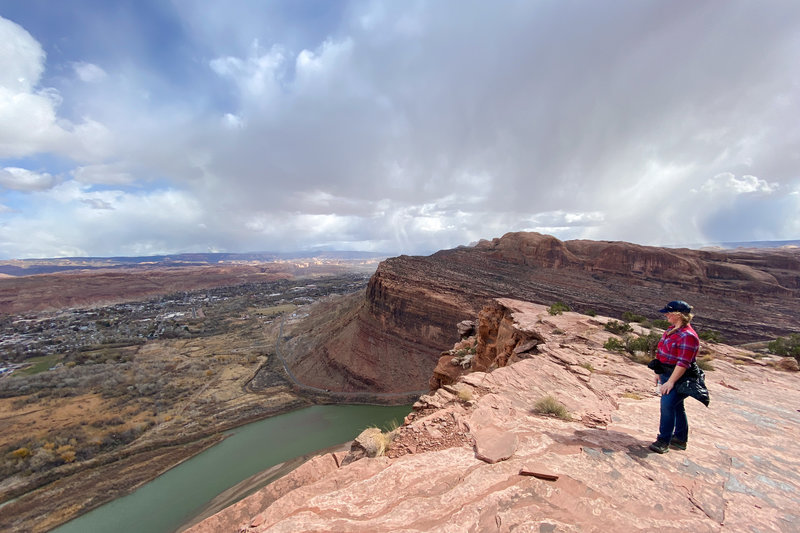 Distant showers sweep over the city of Moab.