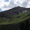 A verdant Mt. Nebo with patches of snow left on it in late July.