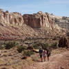 Three hikers traversing the section connecting Wild Horse Canyon to Bell Canyon