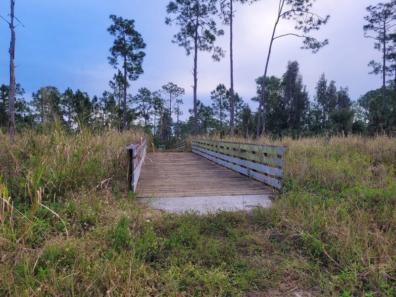 Bridge over canal leading to Prairie Pines Yellow Trail.