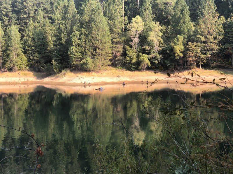 A great view of Paradise Lake from the trail, showing the forests that surround it.