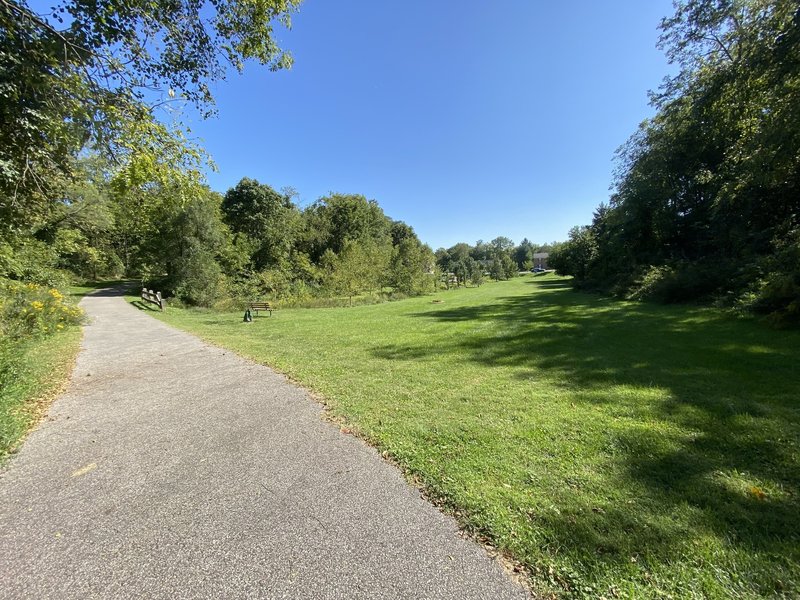 Paved trail through Owens Street Park.