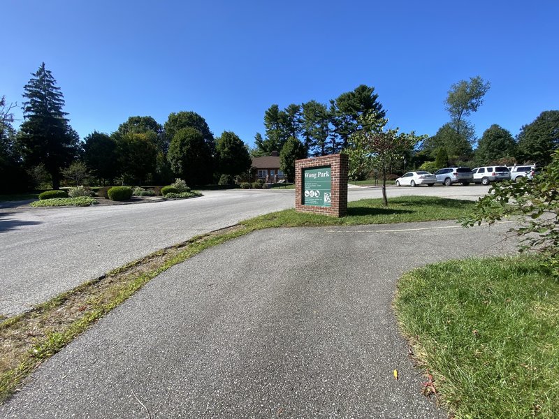 Paved path leading out of Wong Park entrance from Wilson Avenue.