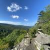 Bedrock outcropping overlooking a tree-filled valley.