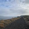 Trail is near water and beautiful plateaus.