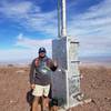 Atop the peak next to the repeater.