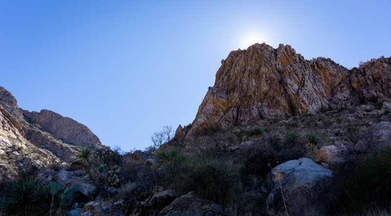 In the shade of the mountains heading up Pusch Peak