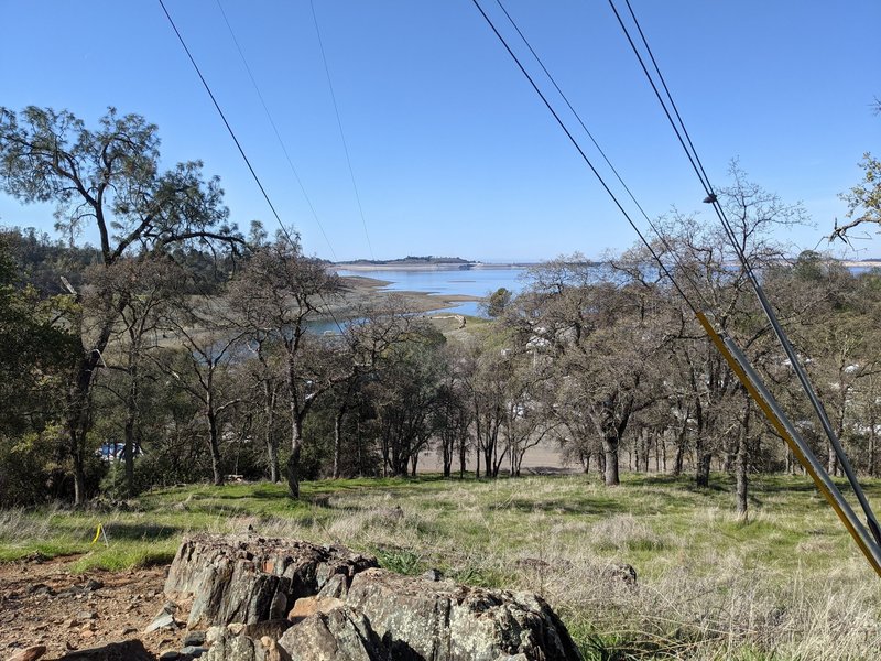 View from trail looking across Folsom Lake towards Folsom Dam.