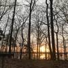 View of the sunrise and lake from camping shelter number 1 off mile 6 of the Cane Creek Trail. Actual location at about (33.94213, -91.79592).