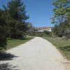 Looking north along the trail, approaching the freeway.