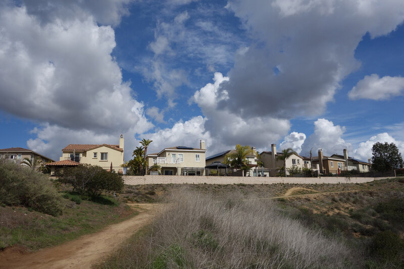 Development at the top of Side Hill viewed on a very clear day with dreamy clouds.