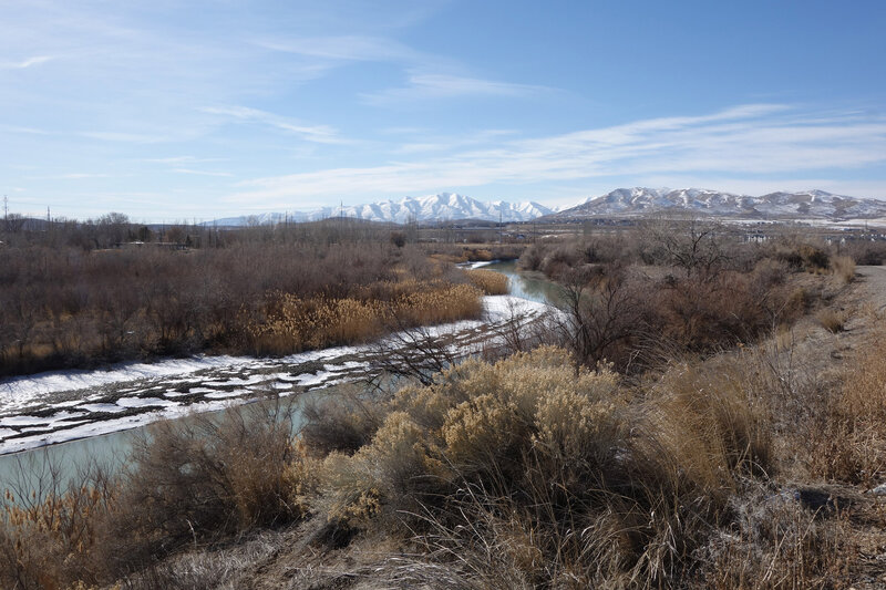 The Jordan River and the distant Oquirrh Range with snowy Flat Top Mountain in the background (center) seen on a very clear pandemic day. Latimer Point is closer, center right.