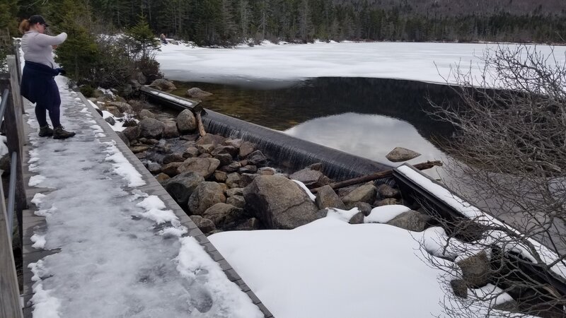 Mid-April partially melted crystal clear water on the boardwalk before heading around the lake by way of the marsh.