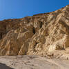 Imagine seasonal floods rushing through this canyon framed by golden colored rocks.