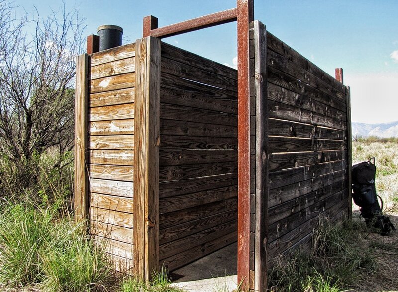 In one place, a out house exists for restroom, as well as a bear box to keep food out of bears hands.