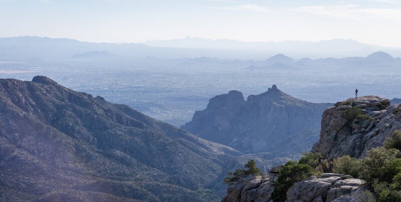 A hiker looking out from Windy Point.