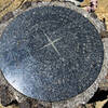 The compass pointing out the other mountains at the summit.