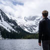 A hiker looking out at Stuart Lake.