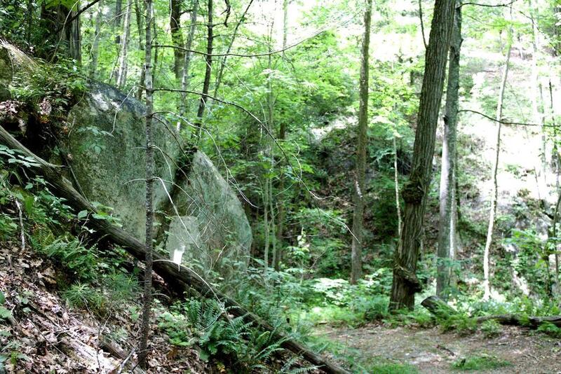 Large stone out-croppings can be seen going up along the side of Loose Mountain.