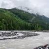 A hiker looking out over Carbon River