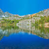 Morning reflection in Cooney Lake. Black Mountain is on the left. Burro Pass in in the center.