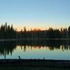 Mt. Lassen catching the first light of dawn and reflecting into Rainbow Lake.