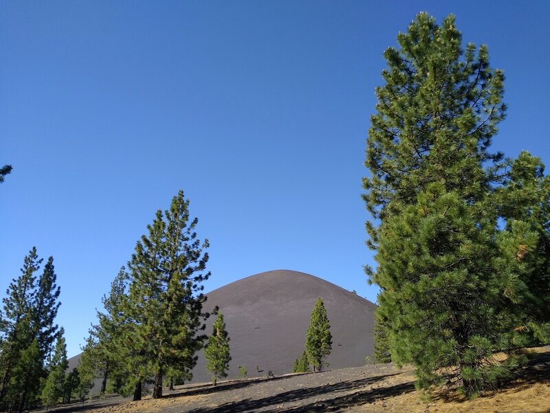 Cinder Cone comes into view when hiking south from the Butte Lake trailhead on Butte Lake to Snag Lake Trail (West).