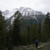 Hiker in front of mountains.