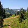 The beautiful meadows and forests covering the high ridges and mountains of Glacier Peak Wilderness. Here, Cady Ridge Trail is approaching a junction with the PCT.