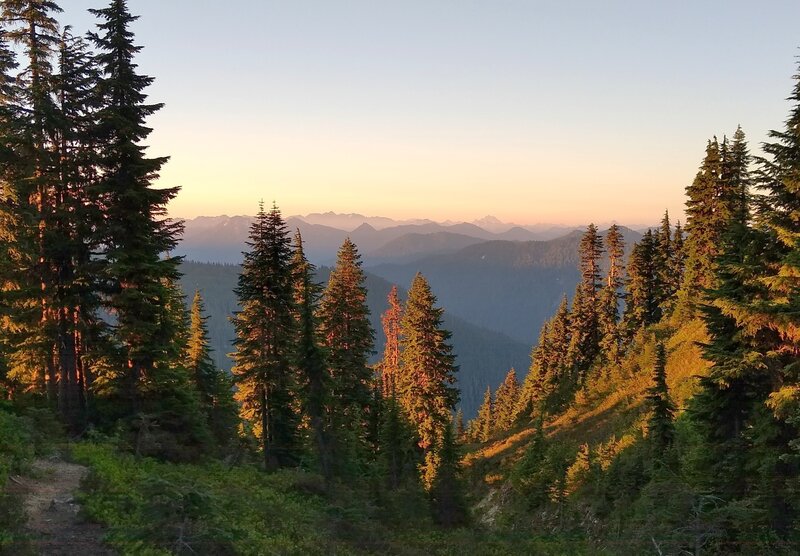 Dawn breaking high in the mountains at Lake Sally Ann Trail camp along the PCT.