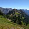 Mountains to the northeast emerge high on Wenatchee Ridge Trail. Whittier Peak, 7,281 ft., is the pointy peak on the far left.