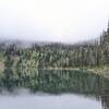 Black Lake western shore amid low clouds.