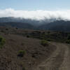 The Folger Ranch Loop Trail breaks off from the Harrington Creek Trail. In the afternoon and evening, you can watch the clouds roll over the hills.