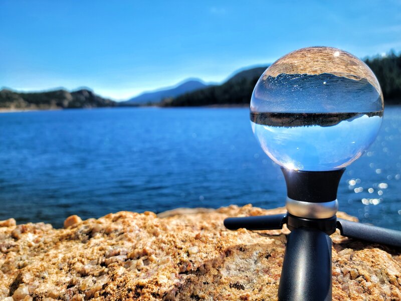 A view of Gross Dam through a lens ball from the Northwestern edge of Gross Reservoir.