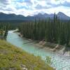 Beautiful, turquoise Snake Indian River and rugged mountains into the distance in the North Boundary Trail backcountry.