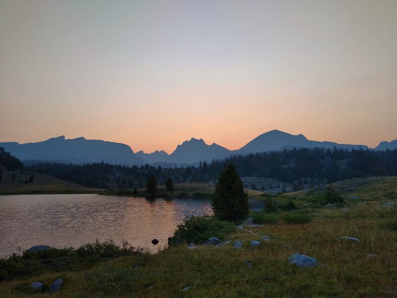 Dawn breaks over the Continental Divide (the far peaks left center), along the CDT near Raid Lake. Just west of the Continental Divide are Pronghorn Peak, 12,388 ft. (left), Mt. Bonneville, 12, 585 ft. (center), and Raid Peak, 12,532 ft. (right).