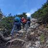 Making use of the available rope to navigate a tricky section.