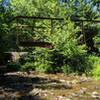 Bridge remains at the end of the abandoned maintenance road.