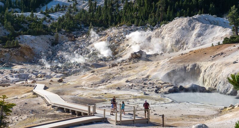 Hikers on the boardwalk in Bumpass Hell.