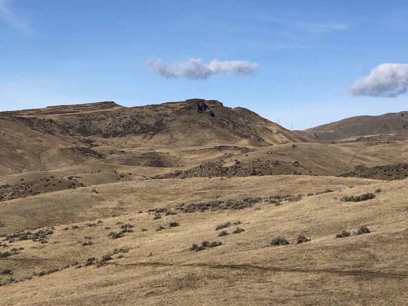 At the end of the trail at Bogus Basin Road looking to the northwest. Chukkar Butte is the rocky outcrop in the distance - Sweet Connie trail runs to the east of the butte.