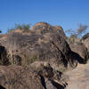 Hiking through eroded volcanic rock on the North Ridge Trail.