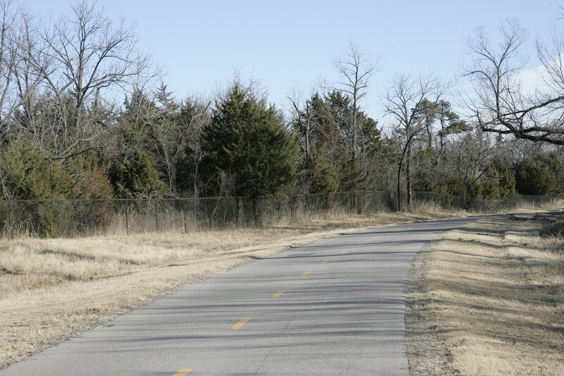 Headed east near S. MacArthur Blvd. in this wintertime photo the close-in trees keep the winds to a minimum for most of the 7.5 mile trail.