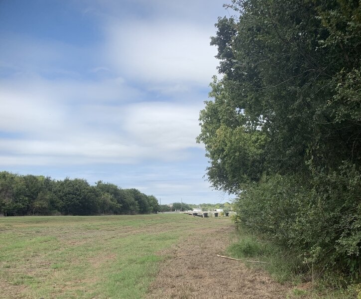 A stretch of flat open trail along the east bank