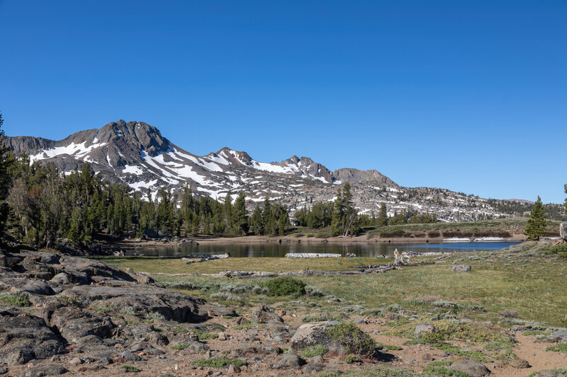 Frog Lake in front of Round Top with the last snow of the season.