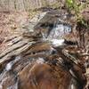 Feeder stream on east loop heading down to Creek, you can see the rock beginning to channel due to erosion.